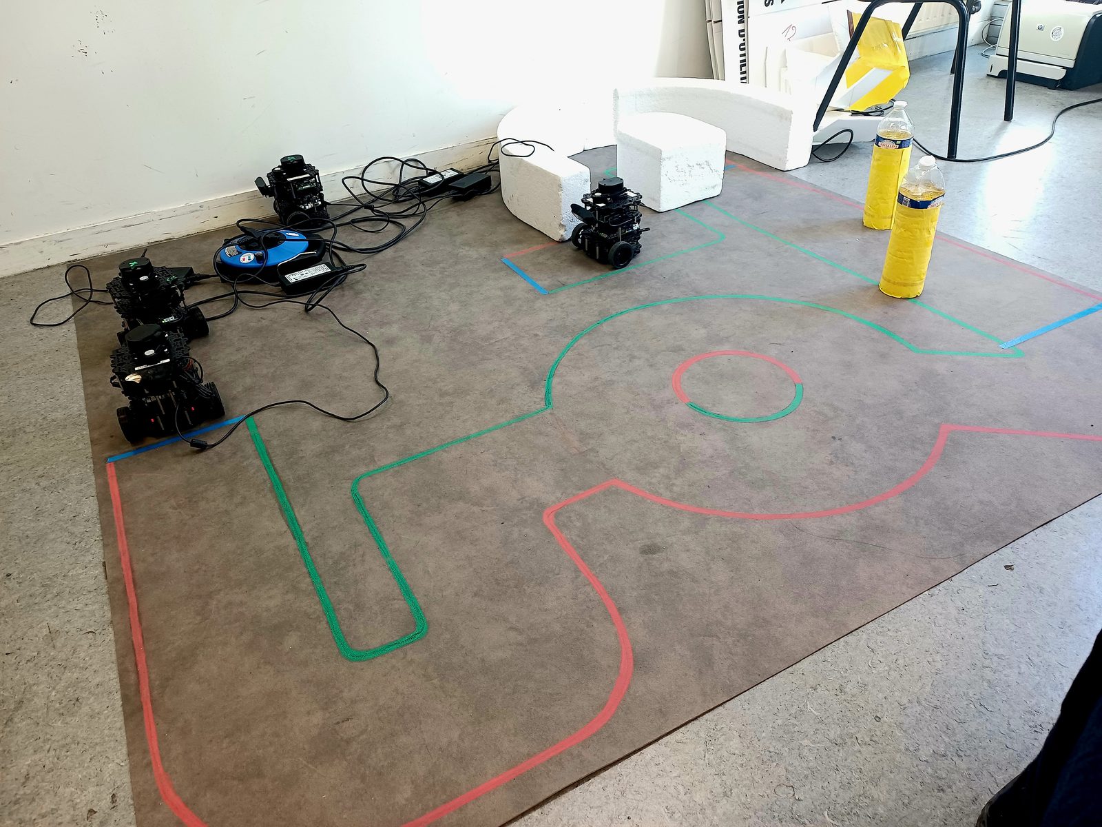 TurtleBot 3 robots on the taped challenge course